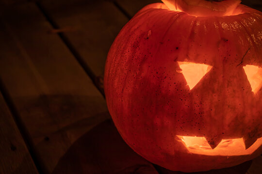 A close up of a jack-o-lantern pumpkin at halloween.