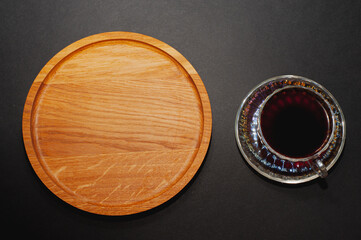 Top view of a cup of coffee, isolate on black background. flat surface with space to copy