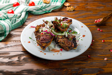 kebab from a rack of lamb on wooden table