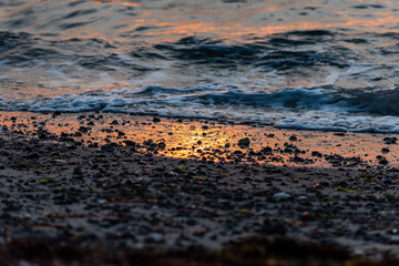 Fototapeta na wymiar Light hits choppy ocean waves at sunset