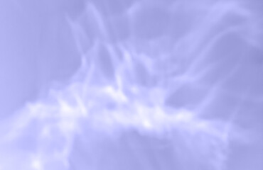 Color of the year 2022. Lights and shadows of glass on light violet blue background. Overlay mode. Caustic effect of light. Sun reflection. Shadows texture. Blurred backdrop. Top view. Trendy concept