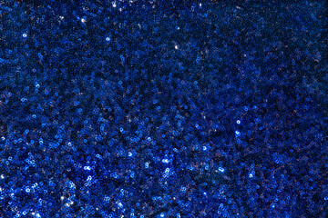 Blue fabric texture with sequins and metallic shiny. holiday sparkling textile with sequins. Blue...