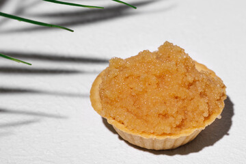 Homemade puff pastry tartlet with pike caviar, isolated on a white background. On a white...