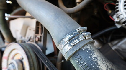 Old rubber hose straps. Dual clamps of automobile radiator hoses of the diesel engine water cooling...