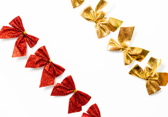  Red and golden shiny festive bow isolated on white background