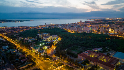Obraz premium Lisbon cityscape during the night, aerial photo, drone.