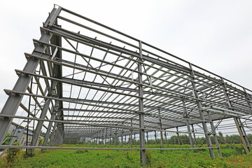 Fototapeta premium The steel beam framework of the plant is in the weeds