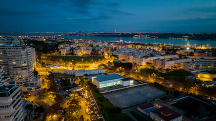 Obraz premium Lisbon cityscape during the night, aerial photo, drone.