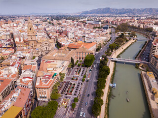 Fototapeta premium Aerial view of part of european city Murcia with coast line of segura river, Spain