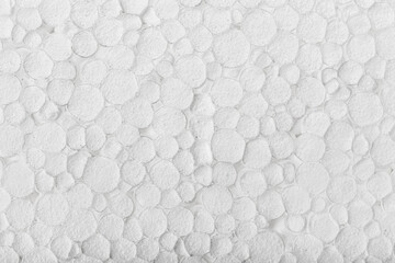 Abstract close up texture photo of compressed white styrofoam background..