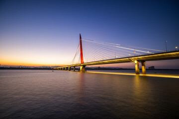 Nanchang Hero Bridge on the calm river in the sunset