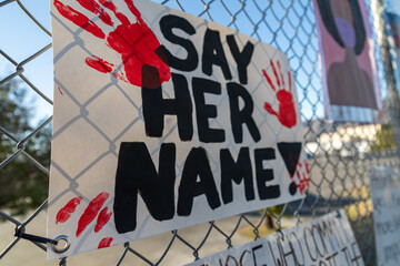 Sign on fence