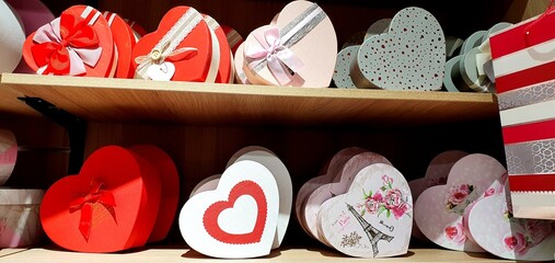 Gift boxes in the form of hearts. A beautiful heart for a gift. Festive gift wrapping.