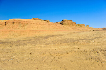 Fototapeta na wymiar Karamay world ghost city, wind erosion landform. In Junggar basin, Karamay, Xinjiang, China