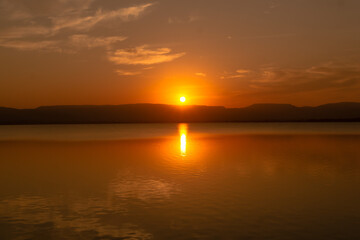 autumn river landscape in Thailand,sunset shines over a blue water lake or river.beautiful orange sunset