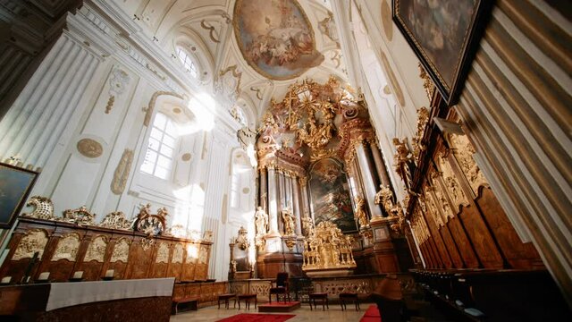 Wide angle view inside a lavish and ornate historic Catholic Church