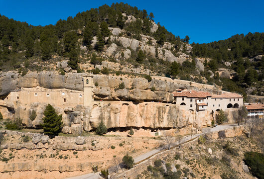 Picturesque rock landscape with medieval Santuario de la Balma built in deep crevice, Valencian Community, Spain..