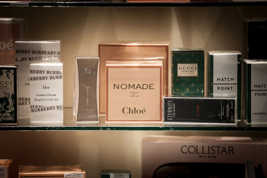 BELGRADE, SERBIA - FEBRUARY 21, 2021: Nomade Chloe logo on their perfume Absolu de Parfum seen in a window of a luxury shop surrounded by other brands. Chloe is a French fragrance, fashion brand