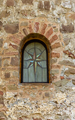 window in the old wall of church