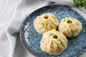 Traditional oriental food - manti with meat. The concept of Oriental cuisine.