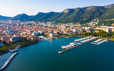 Fototapeta na wymiar Aerial view of city center Como with embankment of lake Como. Italy