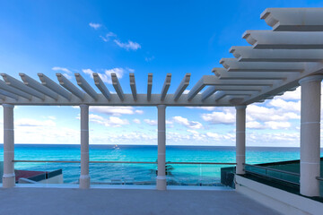 Fototapeta na wymiar Luxury hotels along Cancun Zona Hotelera and Riviera Maya Hotel Zone with scenic beaches, leisure activities, parties and tourist entertainment.