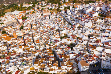 Fototapeta premium Aerial view of central areas of Competa overlooking parish Church of Assumption on sunny fall day, Andalusia, Spain