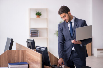 Young male employee working in the office