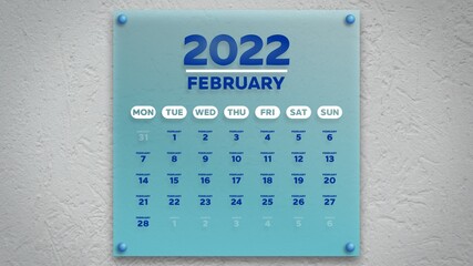 A February calendar 2022 printed on a beautiful blue glass plate  hanging on the wall