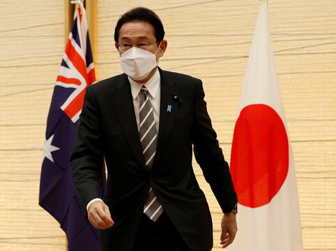 Japan's Prime Minister Fumio Kishida attends a video signing ceremony of the bilateral reciprocal access agreement with Australia's Prime Minister Scott Morrison in Tokyo