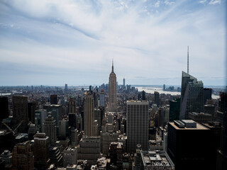 The Empire State Building in New York City from the Rockefeller Centre on a sunny day