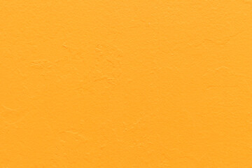 Abstract bright orange painted wall texture background, yellow backdrop