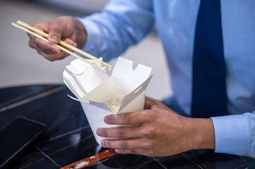 Businessman having his lunch at working place