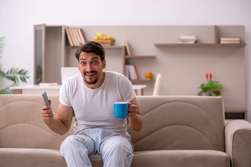 Young male student sitting at home during pandemic