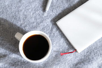 手帳とコーヒー　ビジネスイメージ