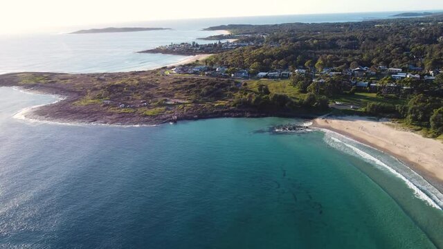 Drone aerial view of Bawley Point landscape beach with suburb and houses South Coast Ulladulla Sydney NSW Australia 4K