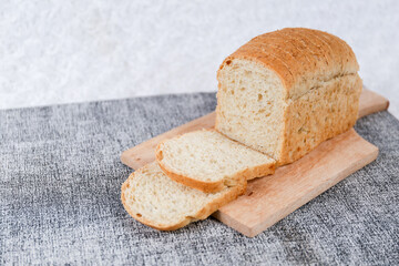 Wheat bread loaf on a white background.