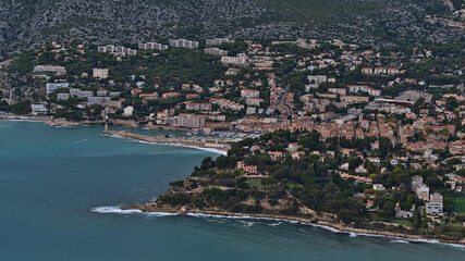 Aerial view of small fishing village Cassis, French Riviera at the mediterranean coast viewed from the top of Cap Canaille with historic port.