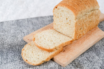 Wheat bread loaf on a white background.