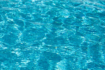 Water in swimming pool, background with high resolution. Wave abstract or rippled water texture.
