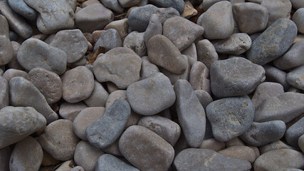 High angle close-up view of round stones at beach in famous bay Calanque d'En-Vau in Calanques National Park near Cassis, French Riviera.