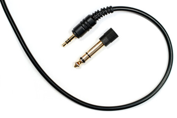 Headphone cable with 3.5 mm jack and 6.3 mm adapter.