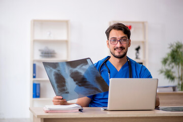 Young male doctor radiologist working in the clinic