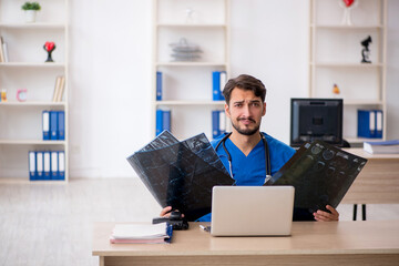 Young male doctor radiologist working in the clinic