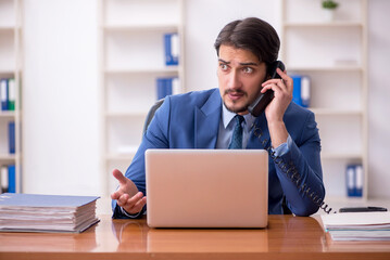 Young businessman employee working in the office