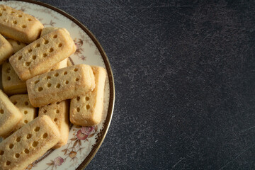 Close Up of Shortbread on a Plate on Dark Background with Copy Space