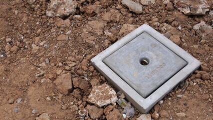 Buried earth rod inspection pit in ground. Ground concrete pits for protection against electrical...