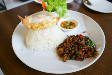 stir-fried pork, stir-fried pork with holy basil and chili .