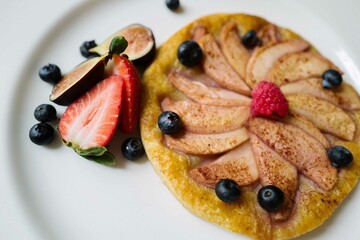 Close up of an Apple pie with fresh berries