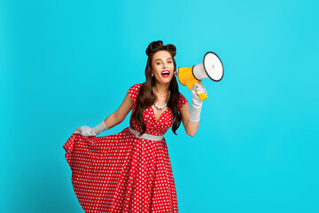Big sale, promo, discount, breaking news. Young pinup woman in retro dress shouting into megaphone...
